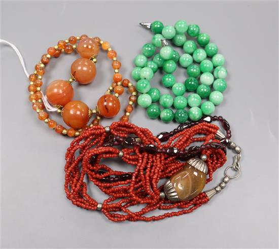 Assorted necklaces including jade and agate.